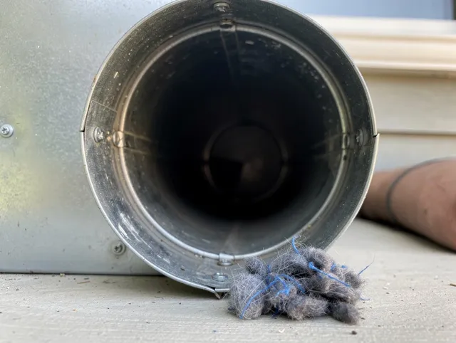 Pembroke Pines Dryer Vent Cleaning technician using specialized equipment to clear severe dryer vent blockage in Pembroke Pines